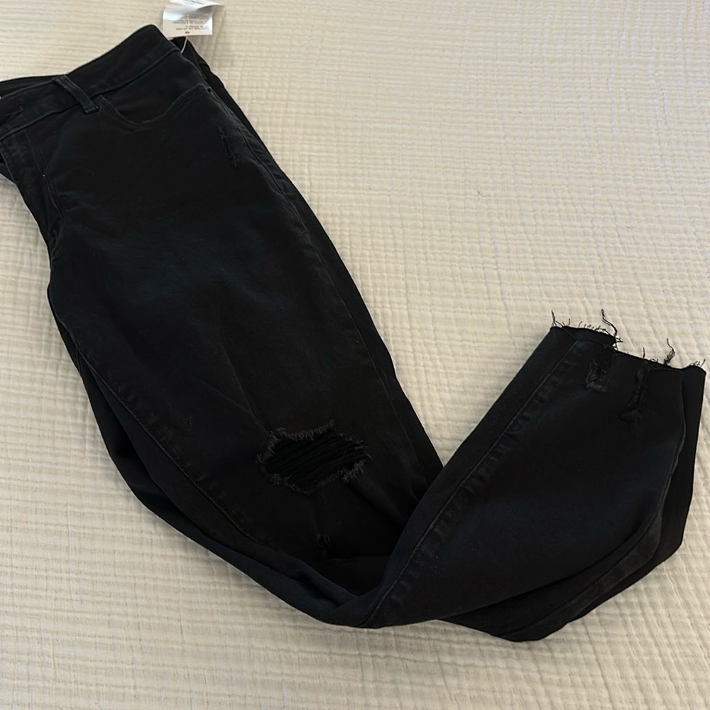 Mid rise destroyed black rockstar super skinny ankle jeans